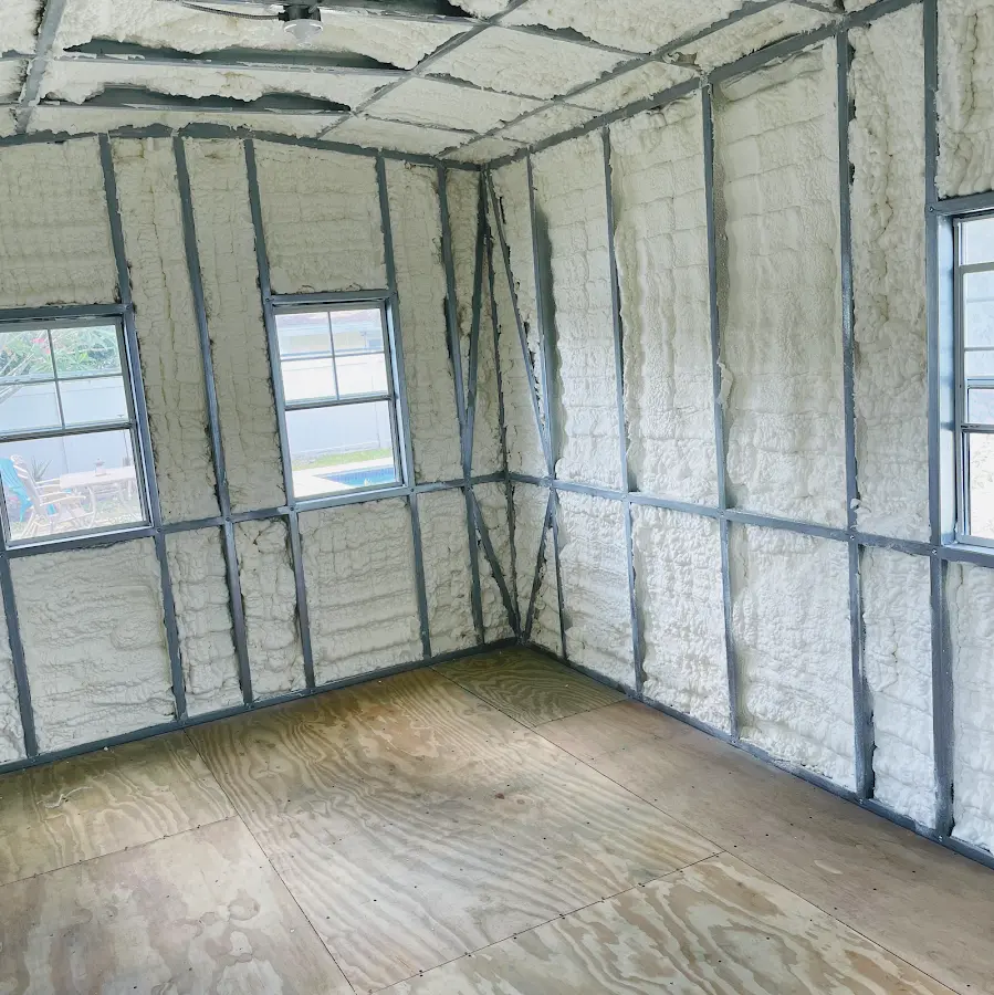 Closed-cell spray foam insulation applied to wall cavities in a residential project in Shelby